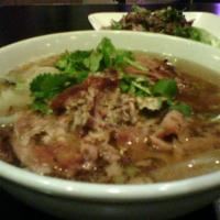 65. Pork Leg Stew Noodles Soup · Specialty pork leg stew with pickles, mustard and bean sprouts.