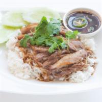 118. Roast Duck · Served with spicy black soy dipping sauce roast duck layered with house sauce.