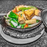 Tofu and Vegetables in Clay Pot · Tofu is fried.