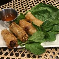 2.  Cha Gio · 4 pieces. Crispy spring roll. Served with lettuce and herbs.