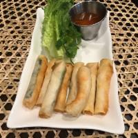 5. Cha Ram · 8 pieces. Crispy shrimp roll. Scallion in wonton rice paper. Served with lettuce and herbs.