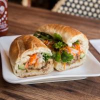C. Pork Belly Sandwich · Pickled daikon, carrot, cucumber, and cilantro.