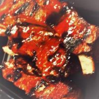 Spare Ribs · Gluten free. Slow cooked and covered in our signature BBQ sauce.
