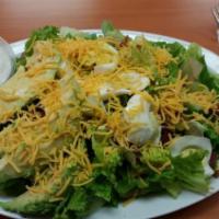 Cobb Salad · Romaine lettuce, avocado, egg, bacon, cheddar cheese, with choice of ranch or blue cheese dr...