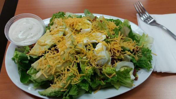 Cobb Salad · Romaine lettuce, avocado, egg, bacon, cheddar cheese, with choice of ranch or blue cheese dressing.