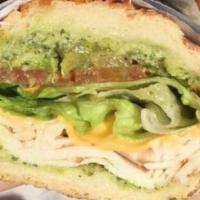 Chicken Pesto Sandwich · Chicken breast, avocado, American cheese, pesto aioli spread, on soft and sweet roll. Includ...