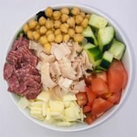 Turkey Chopped Salad · Bed of greens, chopped provolone, roasted turkey breast, salami garbanzo beans, tomato and c...