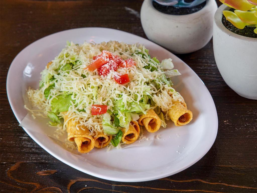 5 Rolled Taco · Served with guacamole, lettuce, tomato,and cheese.