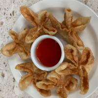 36. Crab Rangoon 蟹角 · Fried wonton wrapper filled with crab and cream cheese.