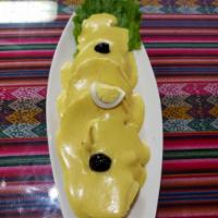 Papa a la Huancaina · Boiled yellow potatoes covered with a little spicy creamy cheese sauce.