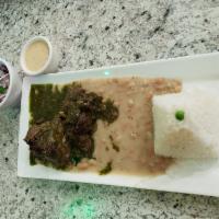 Seco Norteno · A stew of tender beef meat marinated, accompanied with bean and rice.