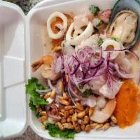 Ceviche Mixto · Made from fresh fish, octopus, calamari and shrimp cure in lime. Accompanied with sweet pota...
