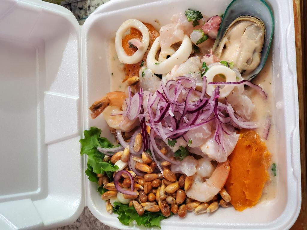 Ceviche Mixto · Made from fresh fish, octopus, calamari and shrimp cure in lime. Accompanied with sweet potatoes, lettuce and corn.