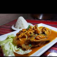 Pescado a lo Macho  · Large fried fish (fillet) coated with a thick sauce with seafood (not spicy)
Served with whi...