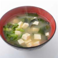 Miso Soup · Miso soybean broth with tofu, seaweed, and scallions.