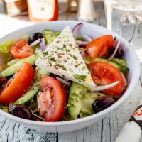 Greek Salad · Lettuce, ripe tomatoes, red onion, cucumber, Kalamata olives, feta cheese topped with our ho...