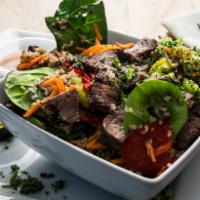 Steak Bowl · A bed of leafy greens topped with our house seasoned organic quinoa. Loaded with roasted col...