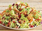Honey Mustard Chicken Crunch · A blend of iceberg and romaine tossed with applewood smoked bacon, red onions, red peppers, ...