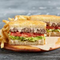 Traditional Frisco Burger · Grilled Parmesan sourdough with crisp lettuce, tomato, pickles and house-made signature swee...