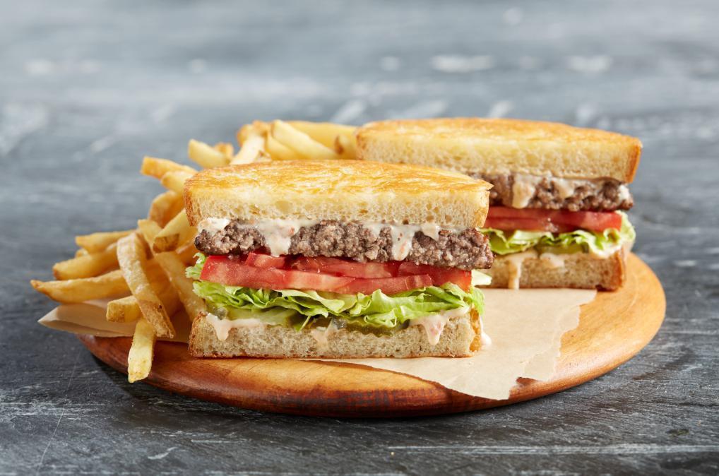 Traditional Frisco Burger · Grilled Parmesan sourdough with crisp lettuce, tomato, pickles and house-made signature sweet gherkin Thousand Island dressing. Made with USDA Angus beef and are grilled medium well. Served with your choice of side.