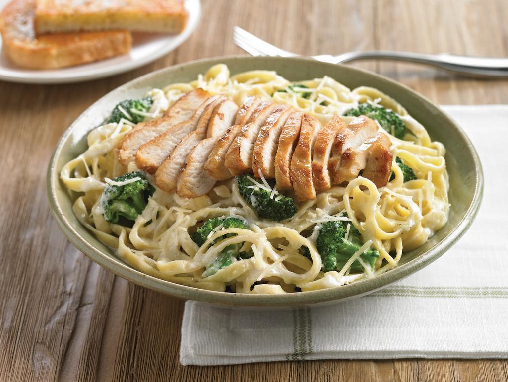 Chicken & Broccoli Fettuccine · Grilled chicken breast served atop fresh broccoli and fettuccine pasta, tossed in a creamy parmesan, romano and asiago alfredo sauce.