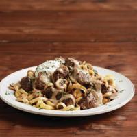Home-Style Beef Stroganoff · Tender beef sautéed with fresh mushrooms in a demi-glace red wine beef sauce, with carameliz...
