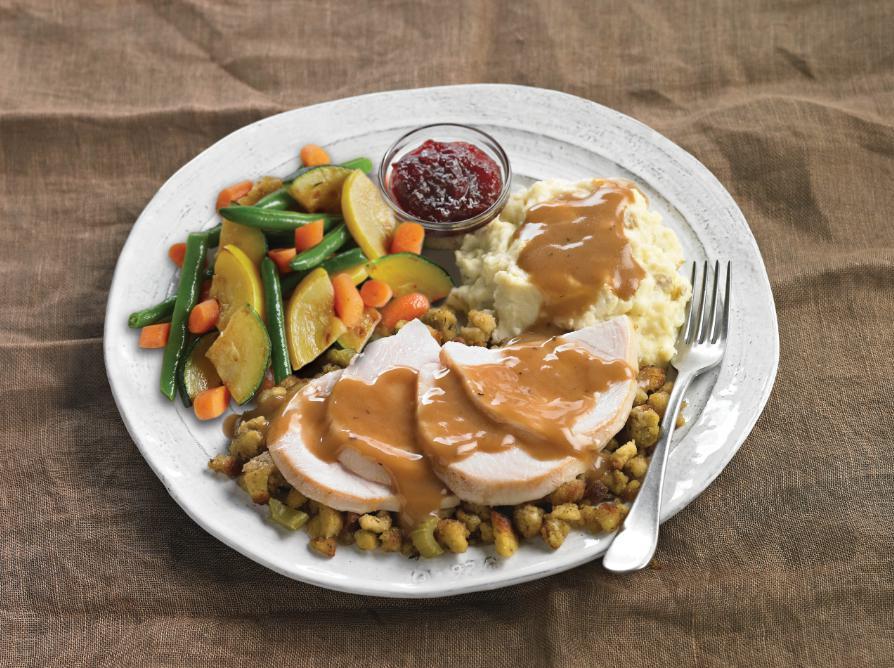 Roasted Turkey Dinner · Hand-carved roasted turkey served over our apple-sage stuffing and topped with house-made giblet gravy. Served with fresh mashed potatoes, tangy cranberry sauce and fresh seasonal vegetables.