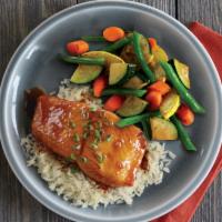 Honey Ginger Glazed Salmon · Grilled salmon fillet brushed with a house-made honey ginger glaze, served atop rice with se...