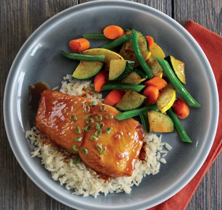Honey Ginger Glazed Salmon · Grilled salmon fillet brushed with a house-made honey ginger glaze, served atop rice with seasonal vegetables.