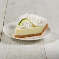 Key Lime Pie Slice · Key limes blended creamy and smooth in a graham cracker crust, topped with fresh whipped cre...
