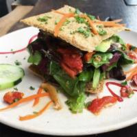 Pesto Panini  (V) · Walnut pesto, avocado, onion, Brazil nut cheese, sun-dried tomato, mixed greens and crispy f...