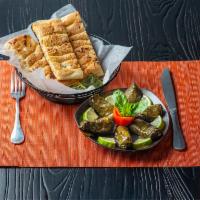 Dolmeh · Sweet and sour grape leaves stuffed with a tantalizing mixture of rice, fresh dill, mint, an...