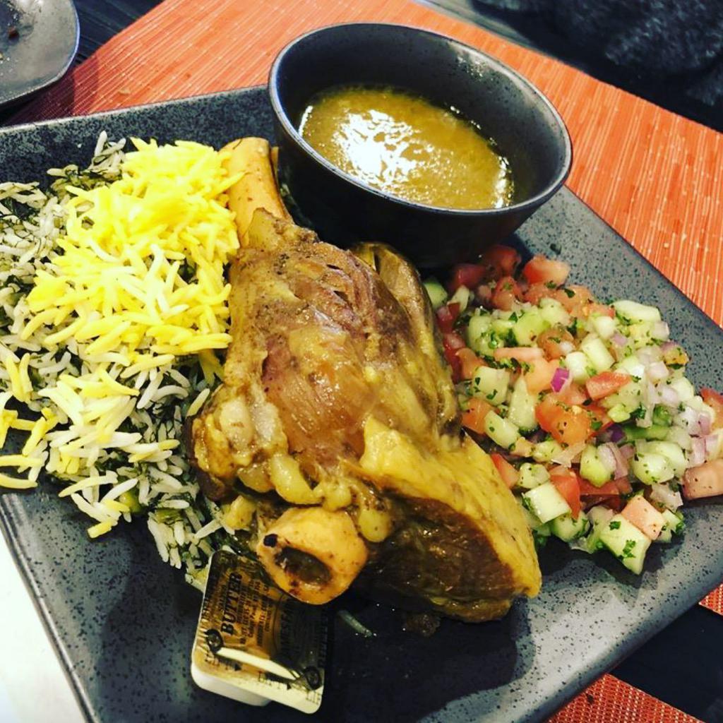 Baghali Polo with Lamb Shank · Served with fresh dill and fava bean saffron rice. Braised lamb shank with herbs and garlic.
*Pictured with Shirazi Salad as a add on