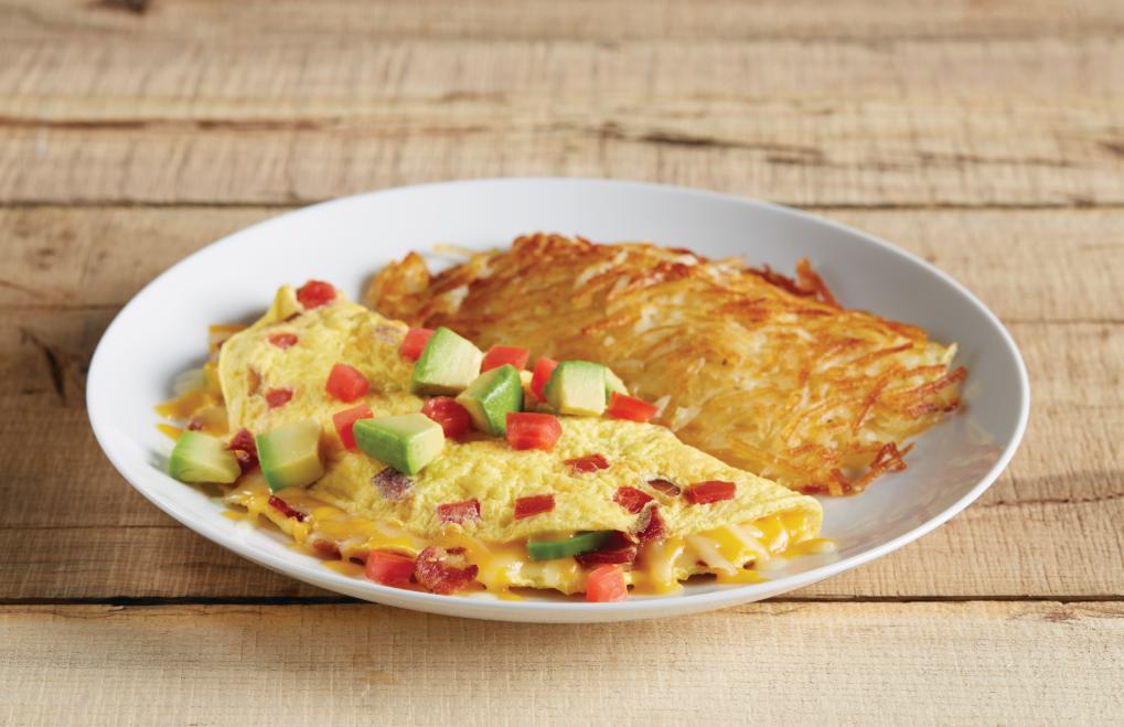 BTA Omelet · Applewood smoked bacon, tomatoes, avocado and cheddar, jack and Swiss cheeses. Served with hash browns, choice of toast, 2 house made, fluffy buttermilk pancakes. Substitute egg whites in any omelet for no additional charge. After 11am; crispy tots replace hash browns.