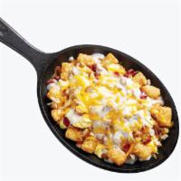 The Big Country Smasher · A crispy bed of crispy tots topped with Applewood smoked bacon, sausage, scrambled eggs and ...