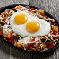 Farmhouse Skillet · Diced ham, mushrooms, oven-roasted tomatoes, fresh vegetables and two eggs any style, with p...