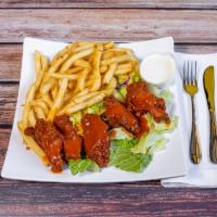 Buffalo Chicken Wings · Enjoy these large spicy chicken drumettes served with french fries and ranch dressing.