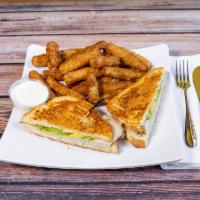 Lucy's Turkey Avocado Melt Sandwich · Fresh sliced turkey with avocado and Swiss cheese served on grilled sourdough bread with a h...