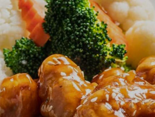 Orange Chicken Plate · Crispy chicken tossed in Orange sauce, topped with sesame seeds and served with steamed broccoli and rice.