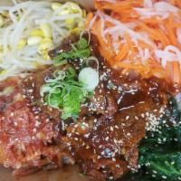 Spicy Korean Pork on Rice · Marinated pork with Korean sweet and spicy sauce served with pickle vegetable