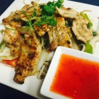 69. Gai Yang · Marinated, boneless chicken grilled in a bed of vegetables.