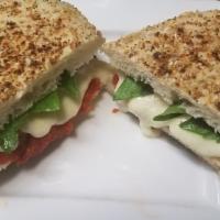 Everything Pizza Panini · Melted fontina cheese, sun-dried tomato spread, fresh basil leaves and extra virgin olive oi...