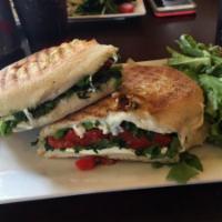 P26 · Grilled chicken panini with melted mozzarella & sauteed broccoli rabe