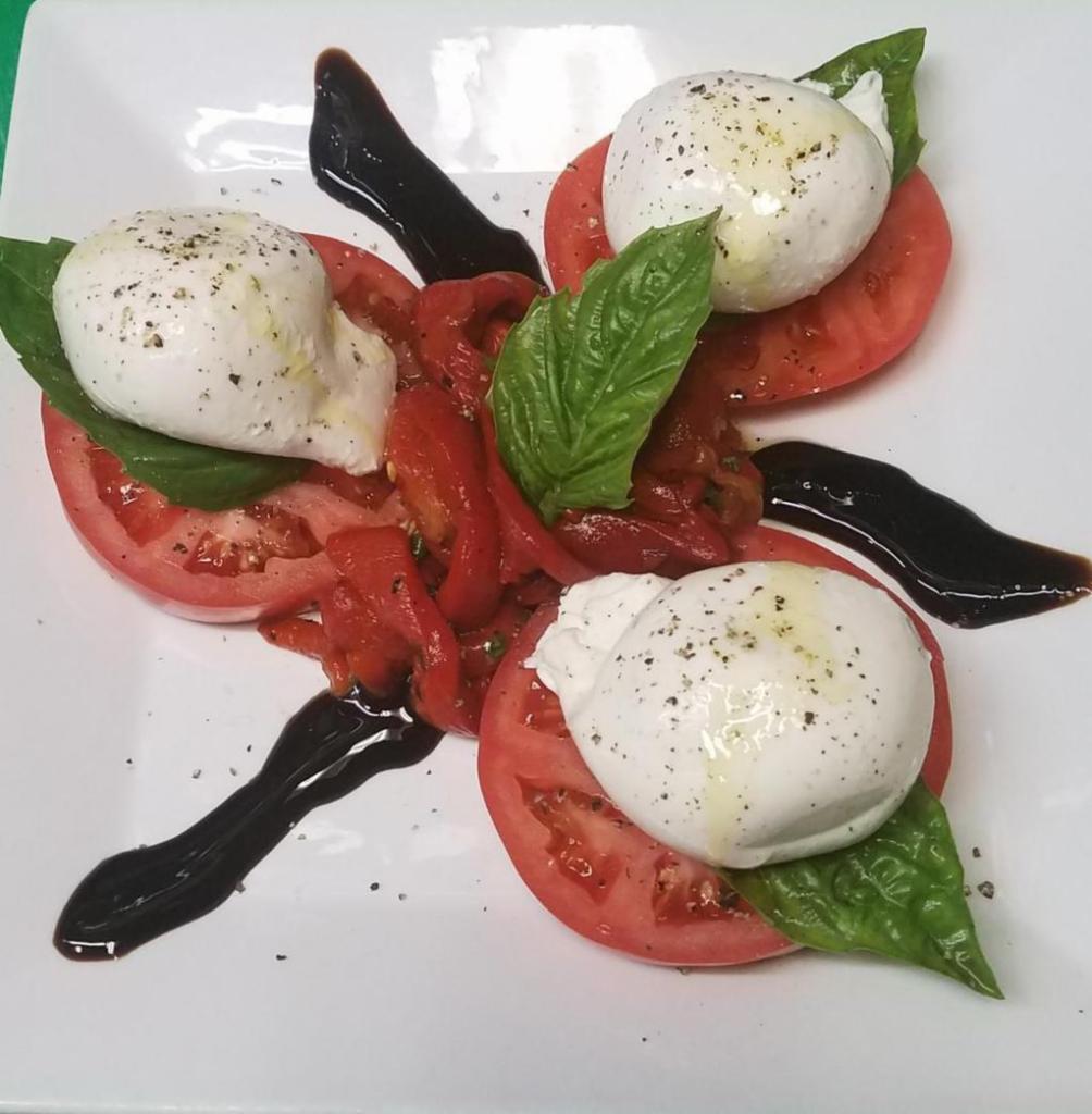 A12 Burrata Caprese · Burrata Caprese. 3 pc Burrata over sliced tomato, fire roasted red peppers, fresh basil leaves and balsamic glaze.