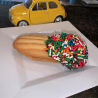 Sprinkle Cookie · Chocolate dipped Sprinkle cookie stuffed with raspberry jam