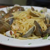 Linguine Alla Vongole · Fresh clams in red or white wine sauce.
