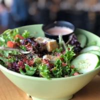The House Salad · Arcadian mix, tomato, cucumber, croutons and smoked bacon. Add chicken salad and protein for...