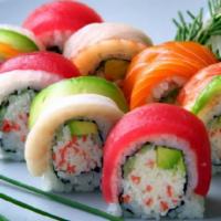 R6. Rainbow Roll · Crabmeat, avocado, cucumber inside, topped with tuna, salmon, shrimp, avocado.