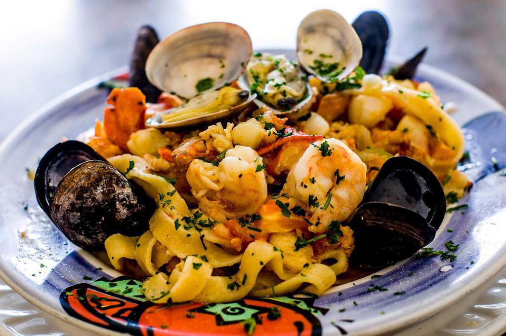 Fettuccini Pescatore · Fresh noodles with scallops, shrimps, lobster meat, mussels, clams, Italian parsley and fresh chopped tomato in white wine, garlic and olive oil sauce.