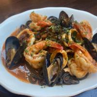 Black Taglierini Frutti Di Mare · Prawns, squid, mussels and guanciale with chiles, white wine, garlic and tomato sauce over B...